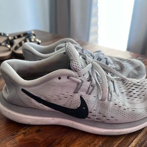 Grey Nike tennis shoes